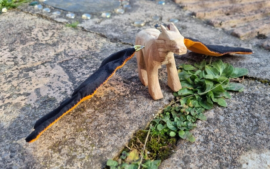 The carved dragon, now with wings.