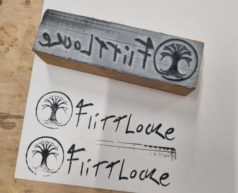 My logo made into a stamp via the laser cutter.